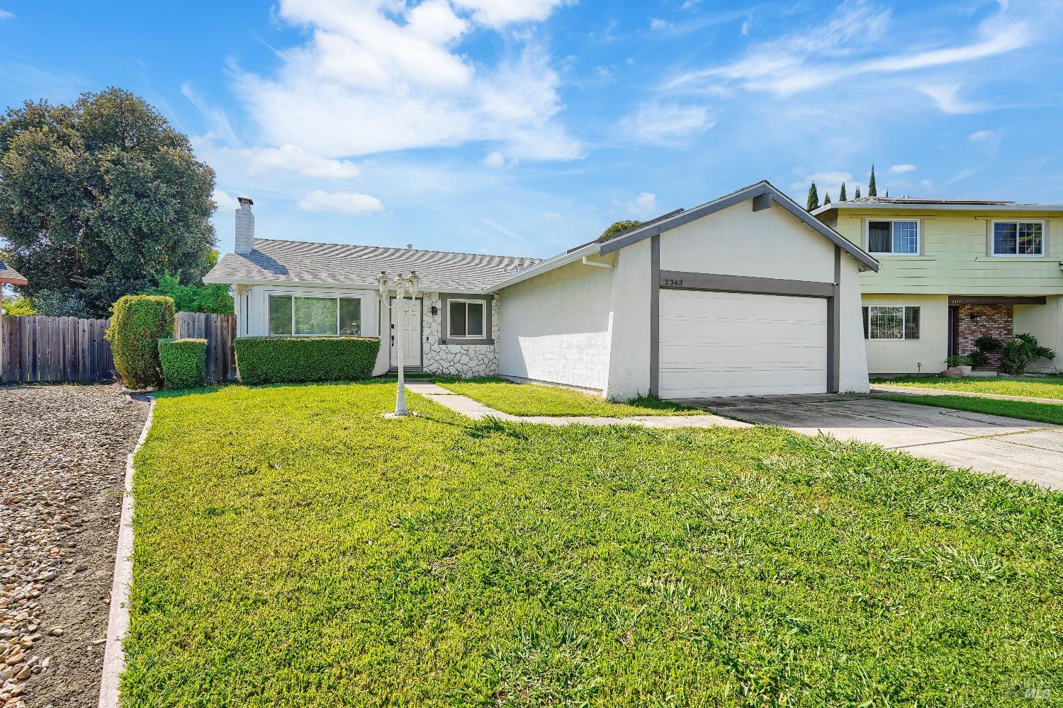 2363 Oceanic Court Fairfield, CA 94533 - Photo 1 of 1 a view of house with a big yard potted plants and large tree