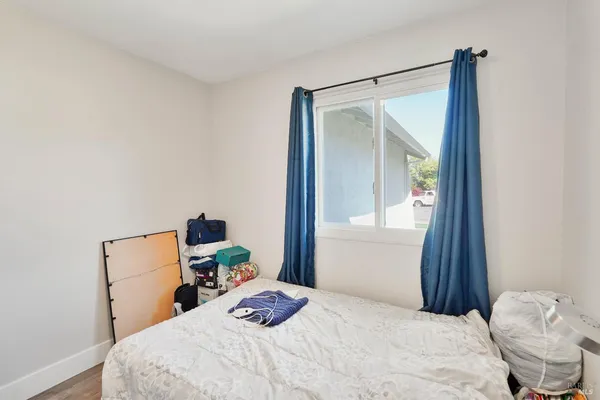 a bedroom with a bed and a mirror
