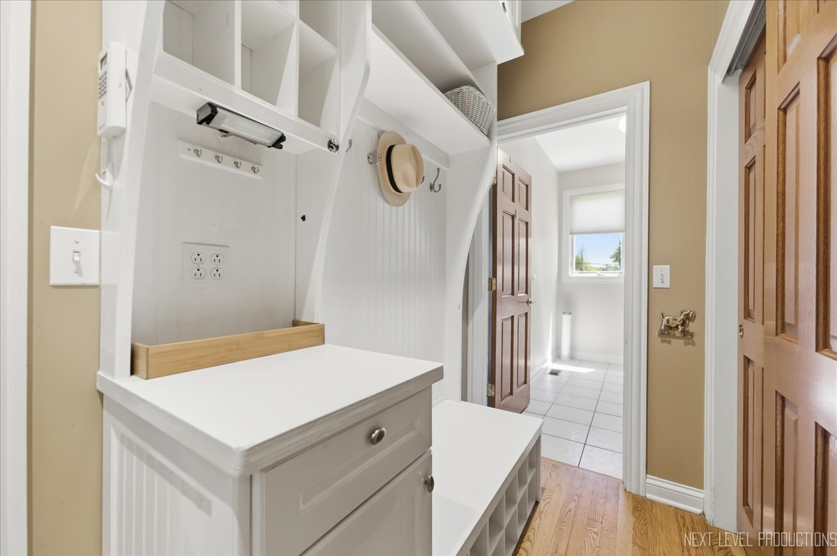 1914 North Ridge Avenue Arlington Heights, IL 60004 - Photo 16 of 50 a bathroom with a sink a mirror a vanity and a shower