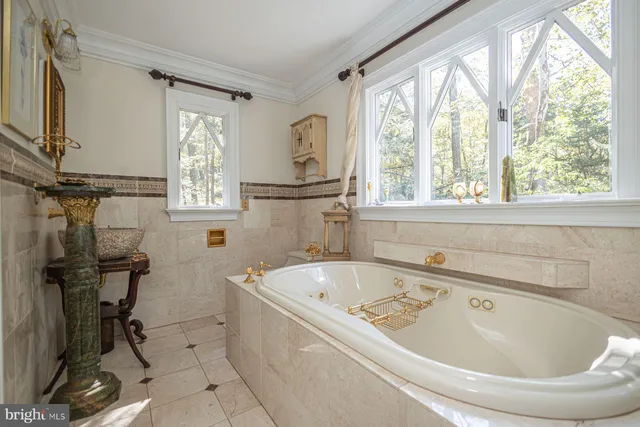 a white bath tub sitting next to a window