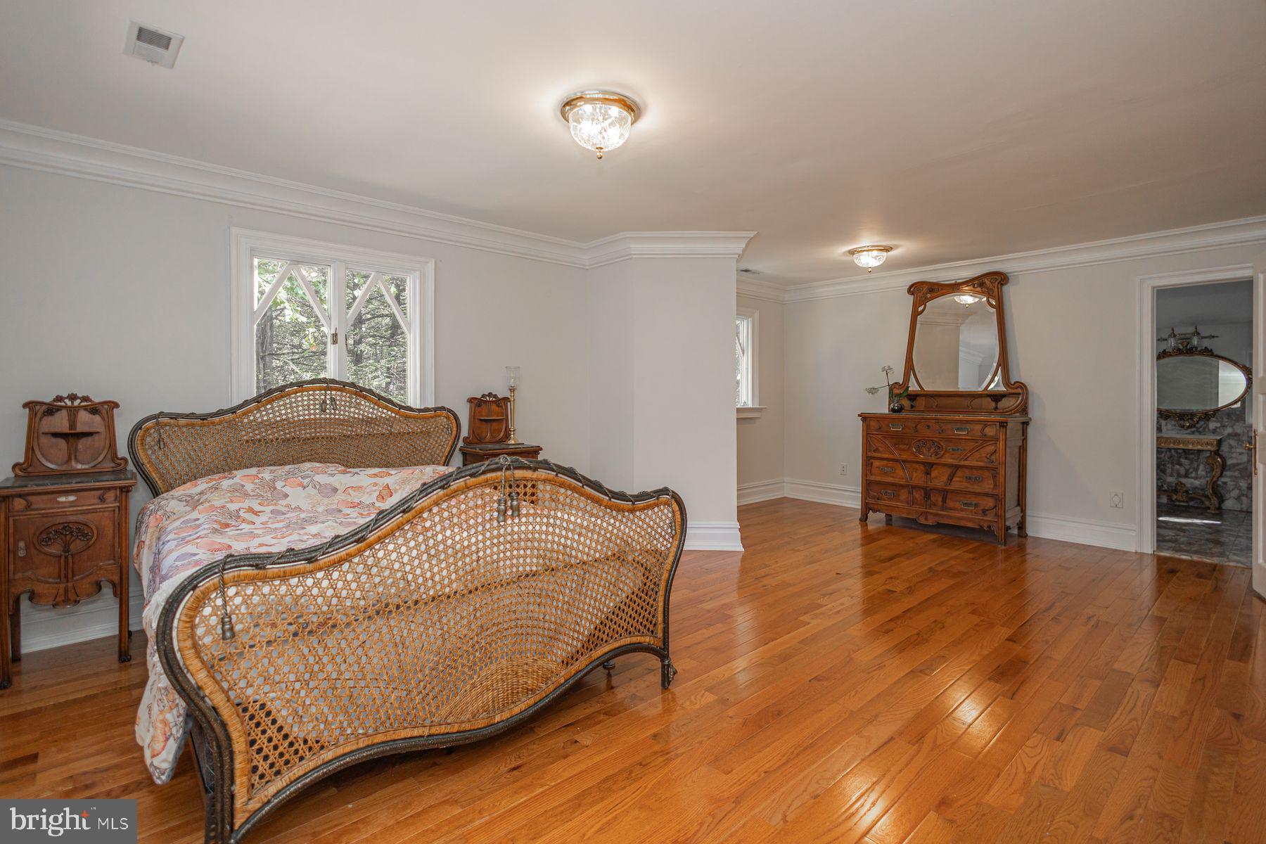 132 East Dark Hollow Road, Unit MAIN Pipersville, PA 18947 - Photo 20 of 29 a bedroom with a bed and window