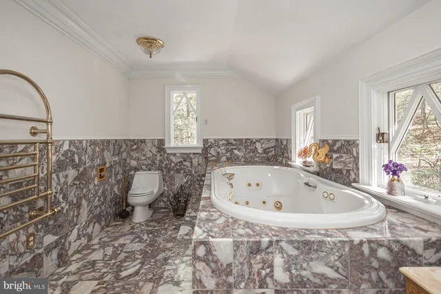 a bath tub sitting in a room next to a window