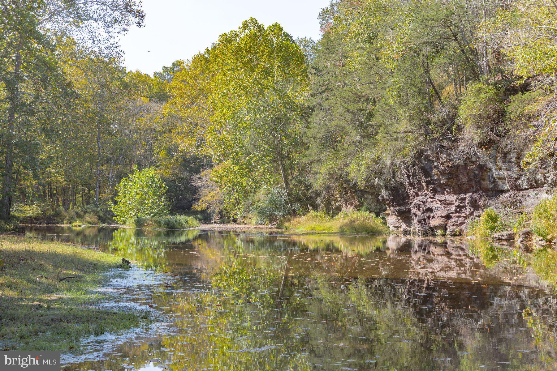 132 East Dark Hollow Road, Unit MAIN Pipersville, PA 18947 - Photo 28 of 29 a view of a lake view with houses