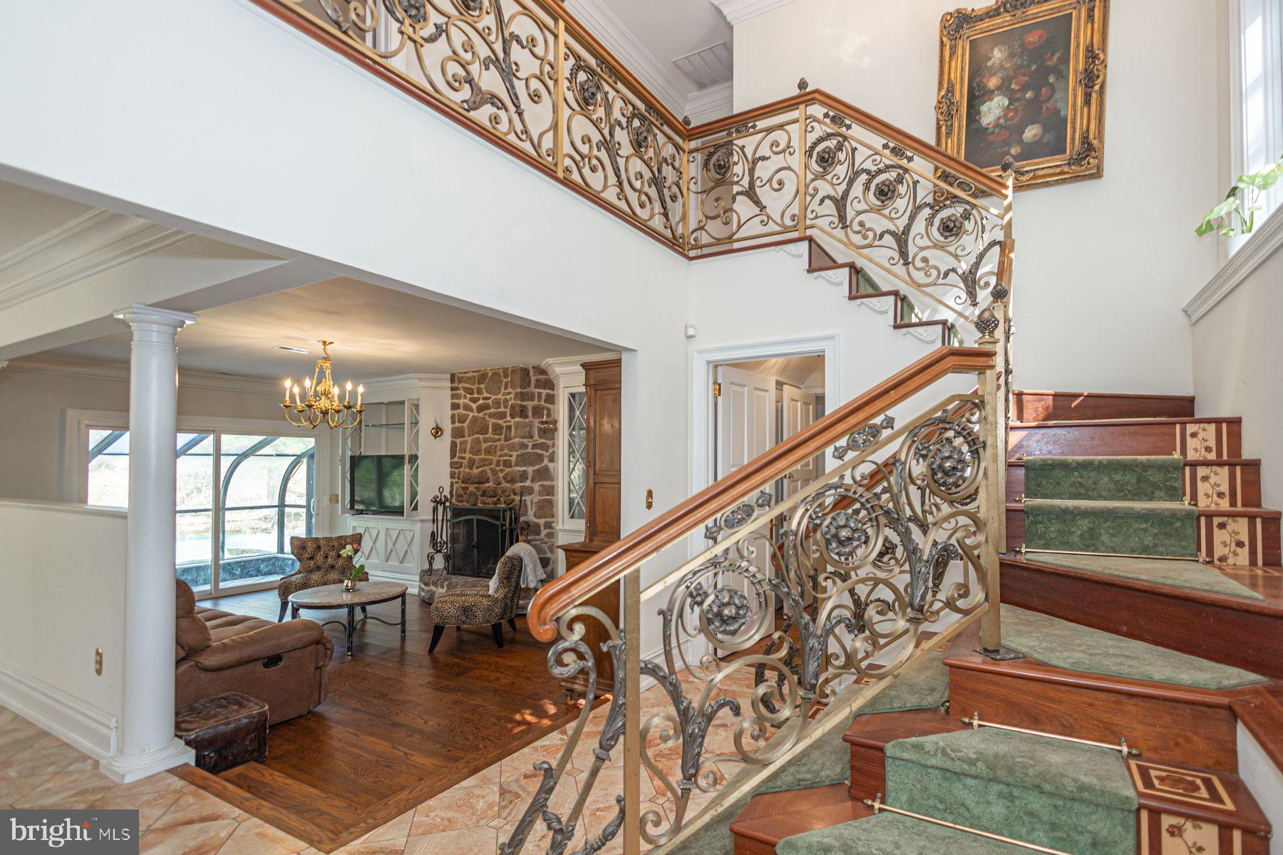 132 East Dark Hollow Road, Unit MAIN Pipersville, PA 18947 - Photo 4 of 29 a living room with stairs