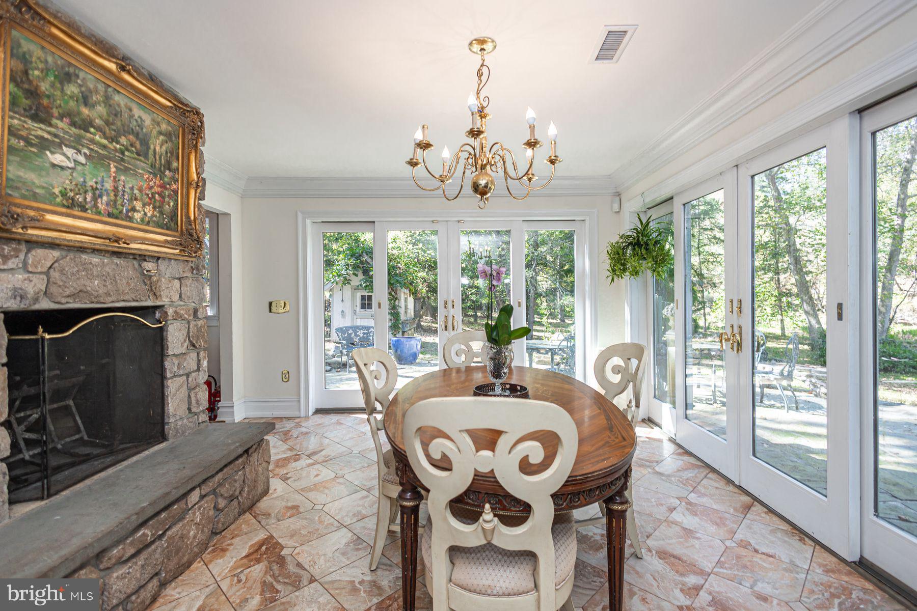 132 East Dark Hollow Road, Unit MAIN Pipersville, PA 18947 - Photo 8 of 29 a living room with furniture and a fireplace