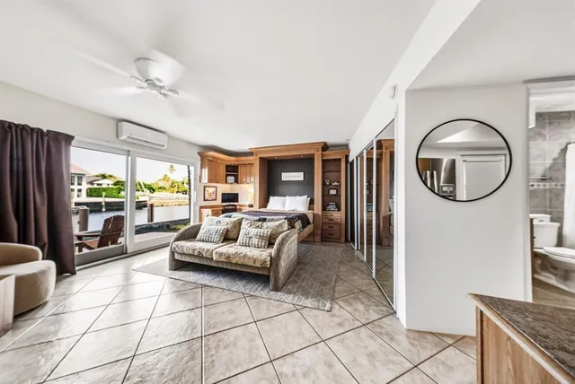 a kitchen with stainless steel appliances a stove a sink and cabinets