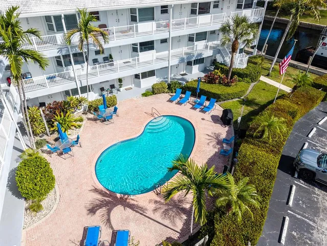 an aerial view of a house with a lake view