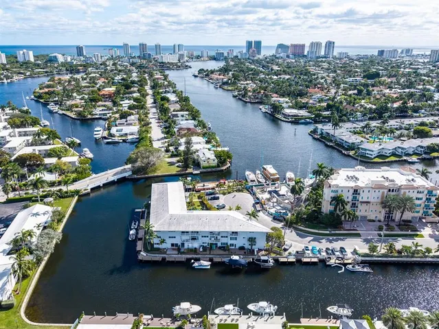 a view of a lake with a table and chairs