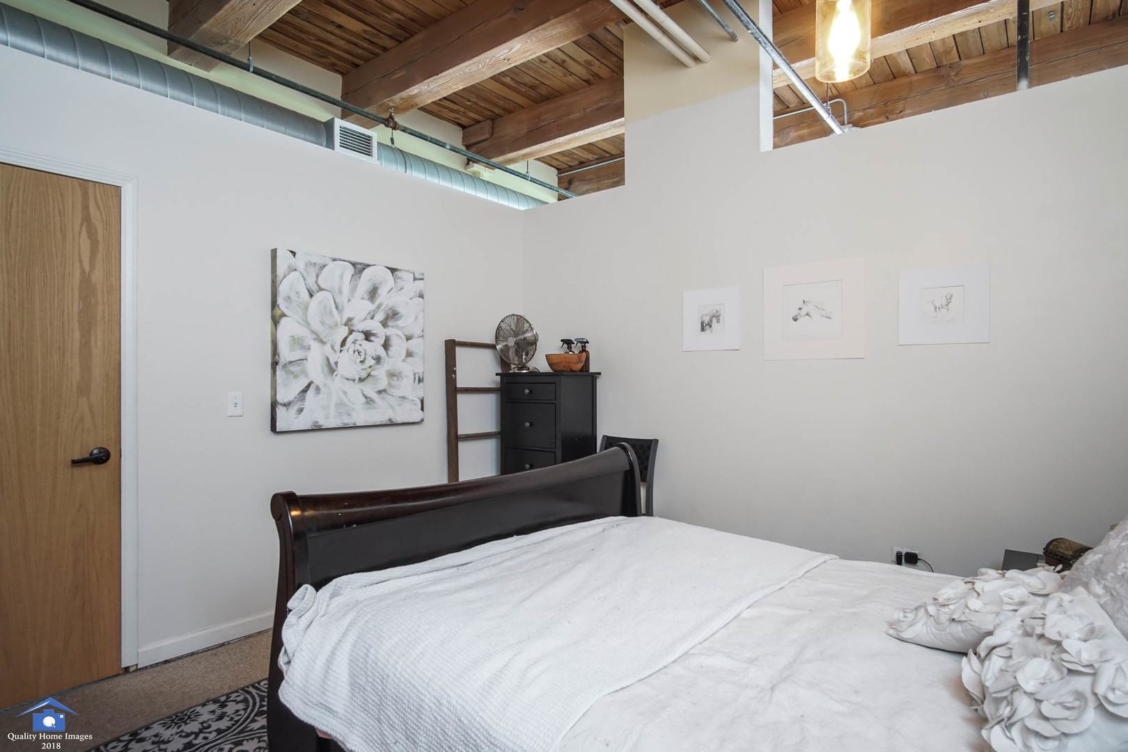 1503 South State Street, Unit 602 Chicago, IL 60605 - Photo 13 of 21 a bedroom with a bed and wall painting