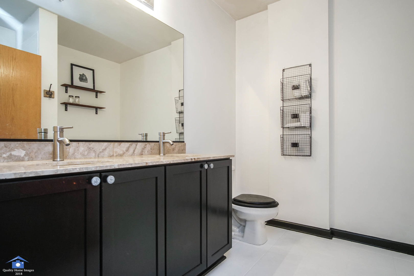 1503 South State Street, Unit 602 Chicago, IL 60605 - Photo 14 of 21 a bathroom with a granite countertop toilet sink and mirror