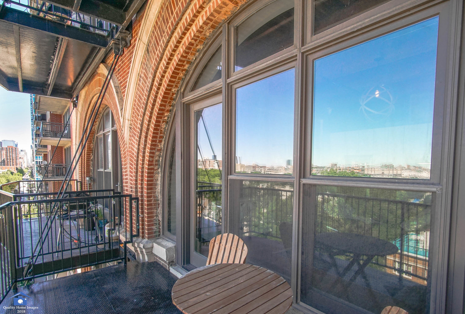 1503 South State Street, Unit 602 Chicago, IL 60605 - Photo 16 of 21 a view of a balcony with chair and glass door