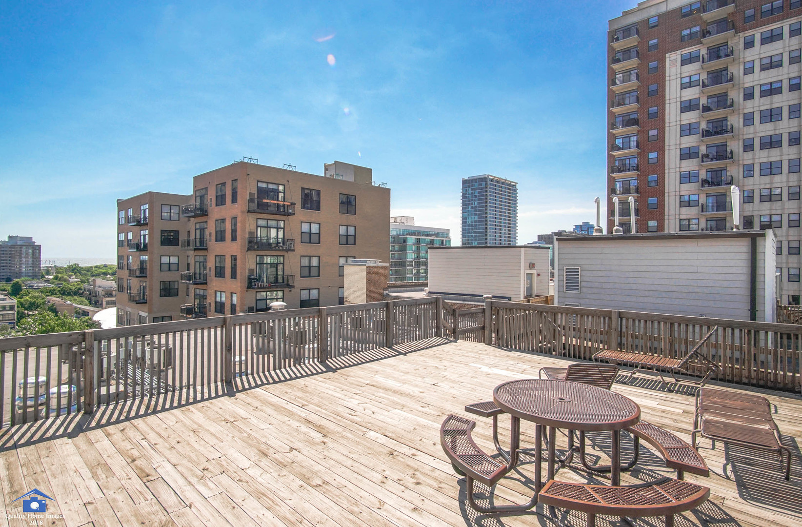 1503 South State Street, Unit 602 Chicago, IL 60605 - Photo 19 of 21 a view of a balcony with a table and chairs