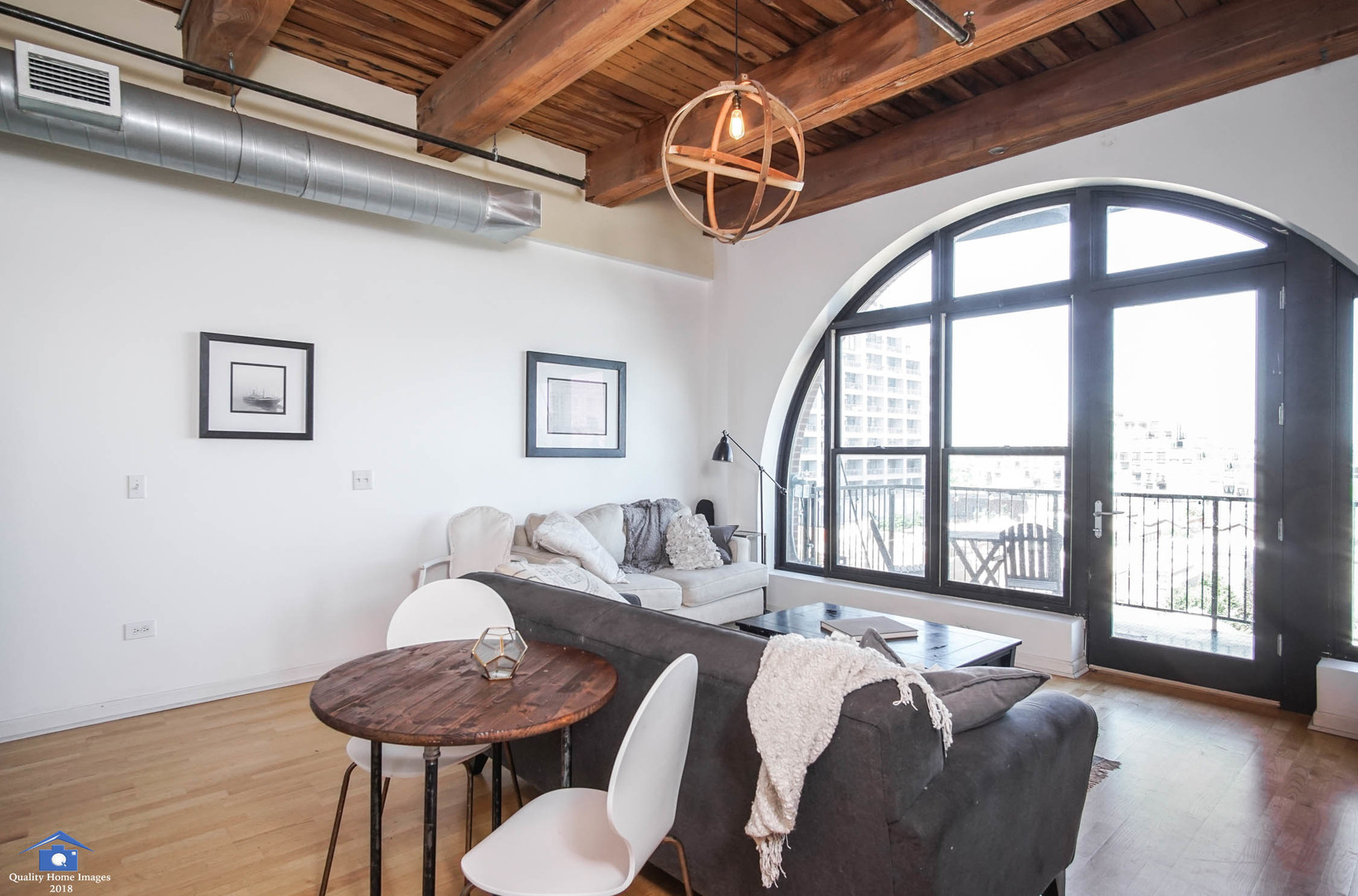 1503 South State Street, Unit 602 Chicago, IL 60605 - Photo 5 of 21 a living room with furniture and a large window