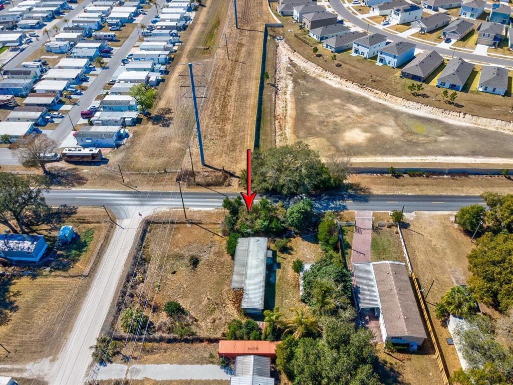 4512 Lane Road Zephyrhills, FL 33541 - Photo 13 of 14 an aerial view of a house with a garden