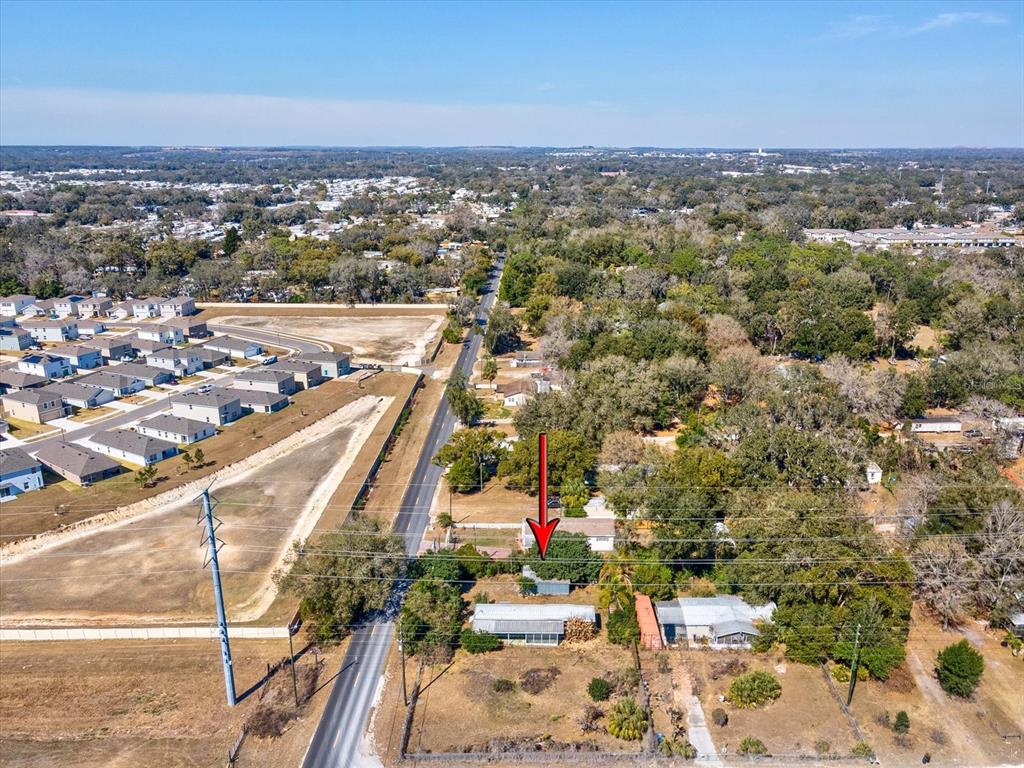 4512 Lane Road Zephyrhills, FL 33541 - Photo 14 of 14 an aerial view of a city