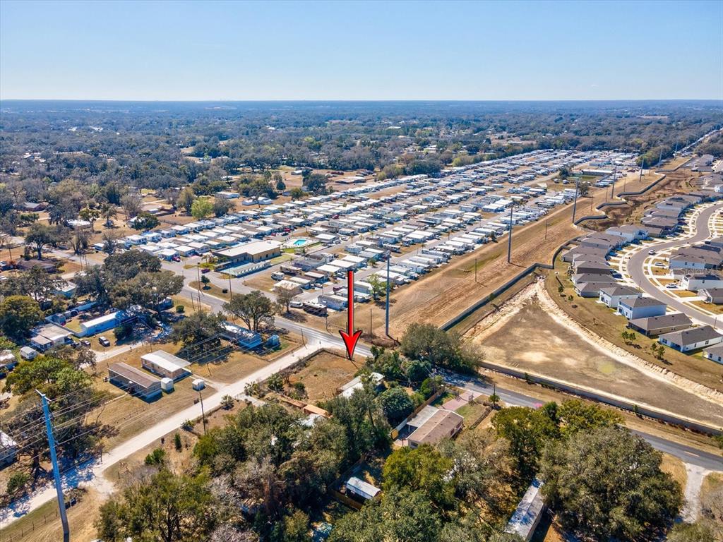 4512 Lane Road Zephyrhills, FL 33541 - Photo 4 of 14 an aerial view of multiple house