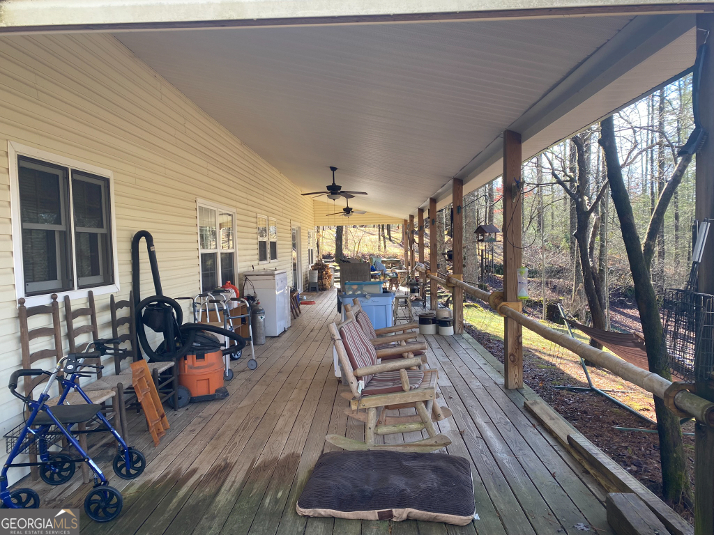 2594 Blue Ridge Gap Road Clayton, GA 30525 - Photo 11 of 77 a living room with furniture floor to ceiling window and wooden floor