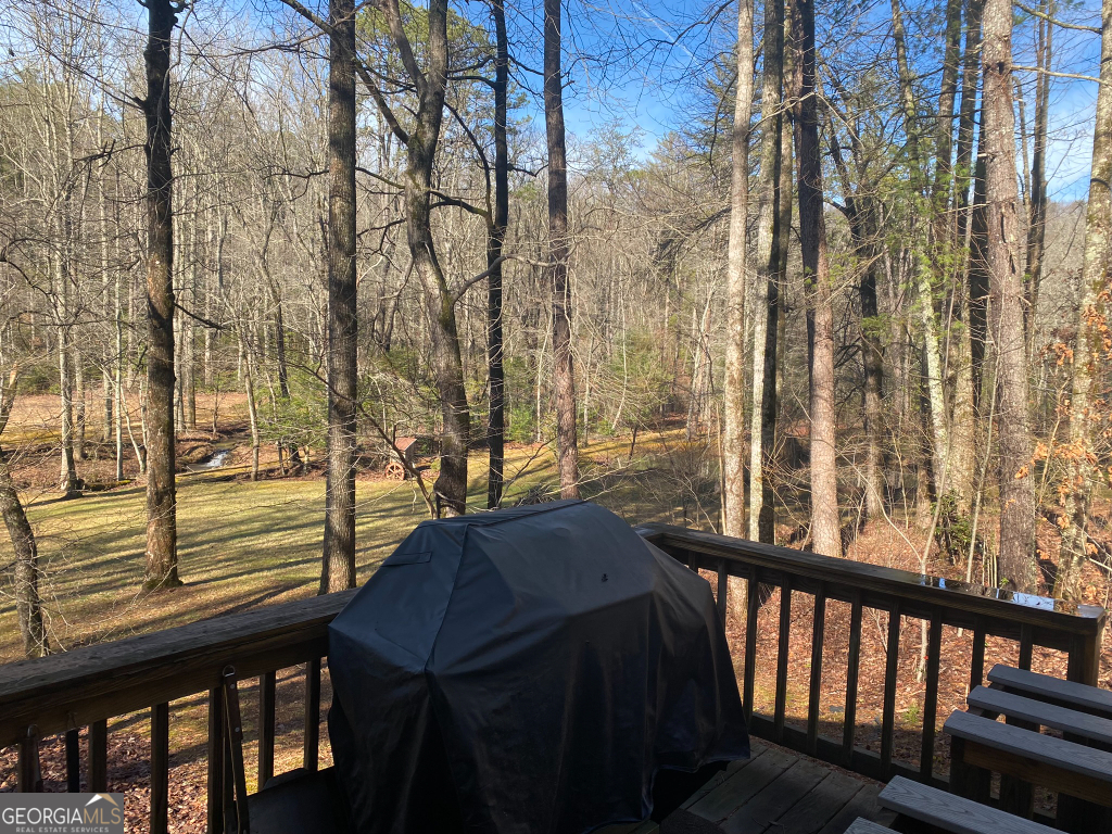 2594 Blue Ridge Gap Road Clayton, GA 30525 - Photo 12 of 77 a view of a balcony with chairs