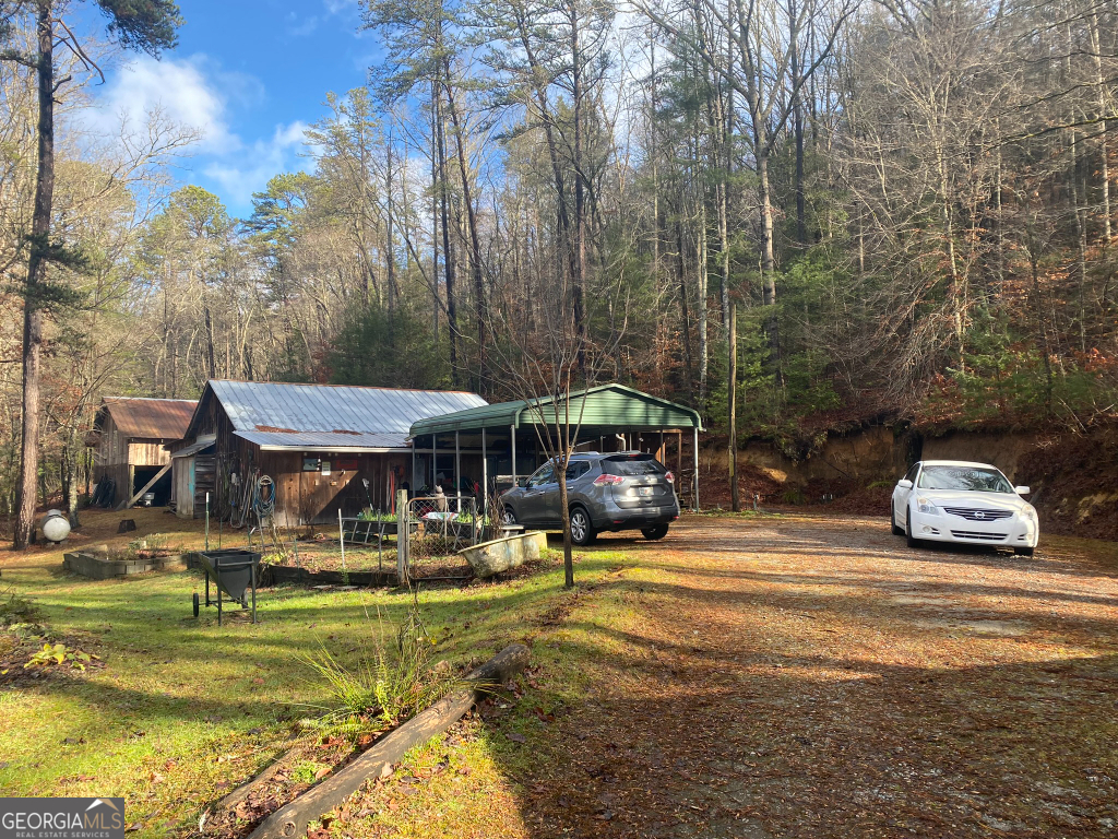 2594 Blue Ridge Gap Road Clayton, GA 30525 - Photo 19 of 77 a swimming pool view with a seating space and a garden view