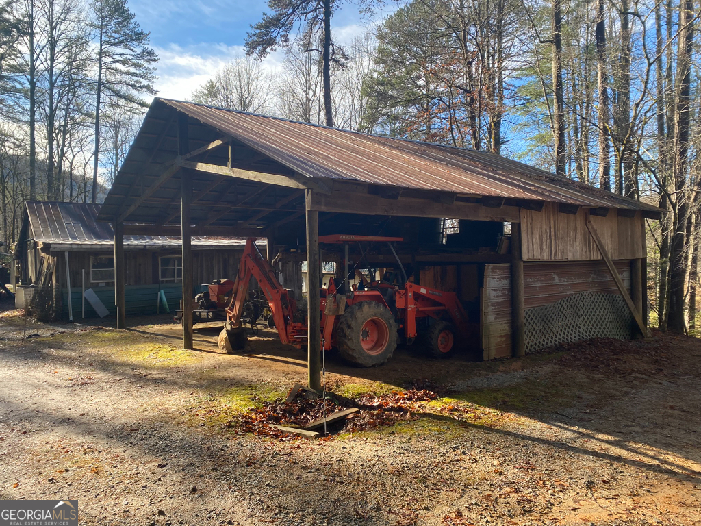 2594 Blue Ridge Gap Road Clayton, GA 30525 - Photo 26 of 77 a view of a garage with rack and bicycle