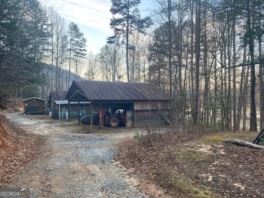 2594 Blue Ridge Gap Road Clayton, GA 30525 - Photo 27 of 77 a view of a house with a yard and tree