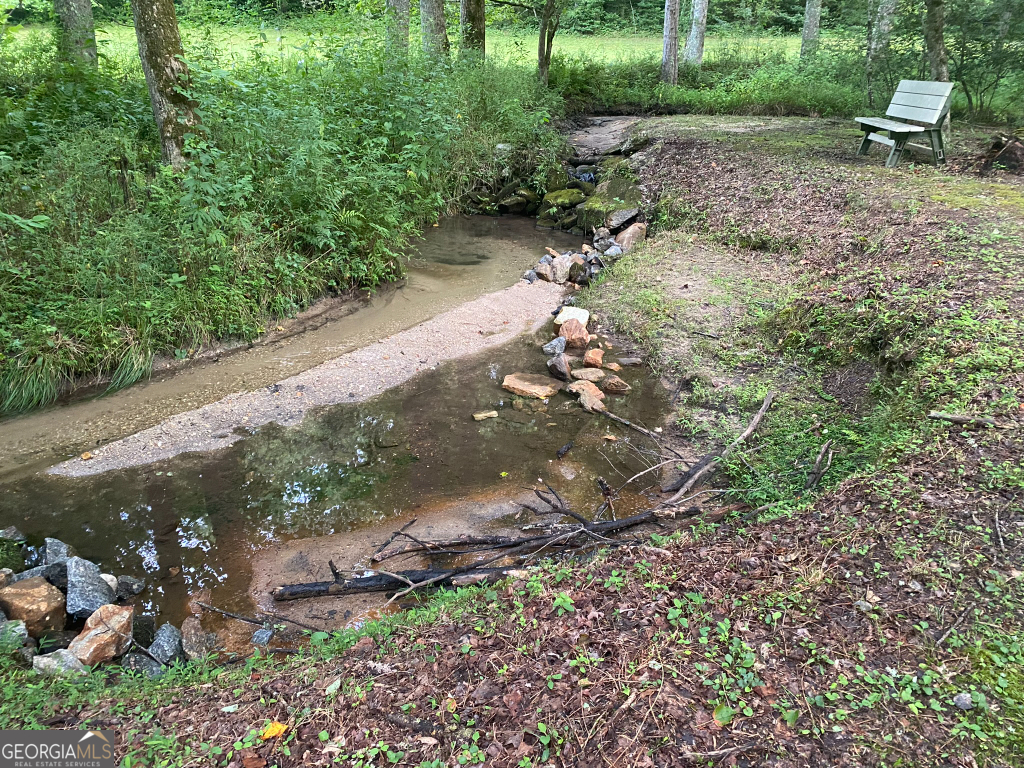 2594 Blue Ridge Gap Road Clayton, GA 30525 - Photo 32 of 77 a backyard of a house with a yard with outdoor seating