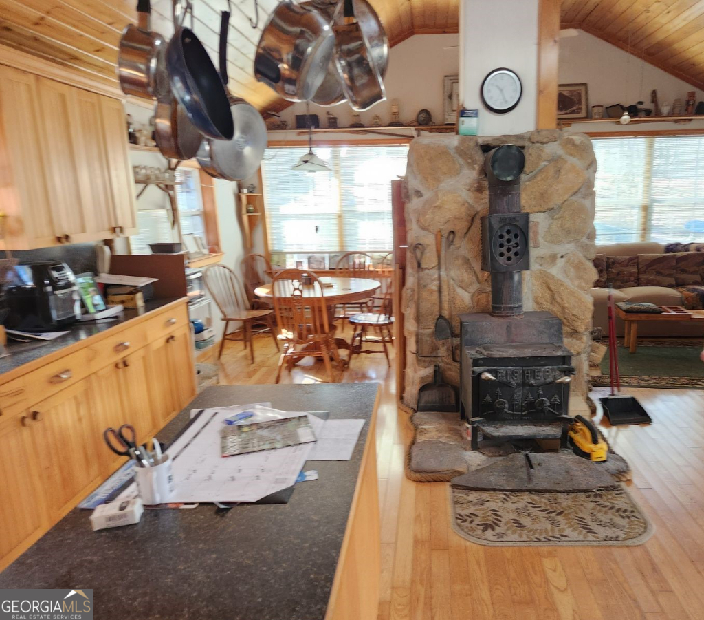 2594 Blue Ridge Gap Road Clayton, GA 30525 - Photo 4 of 77 a living room with couches and kitchen view with wooden floor