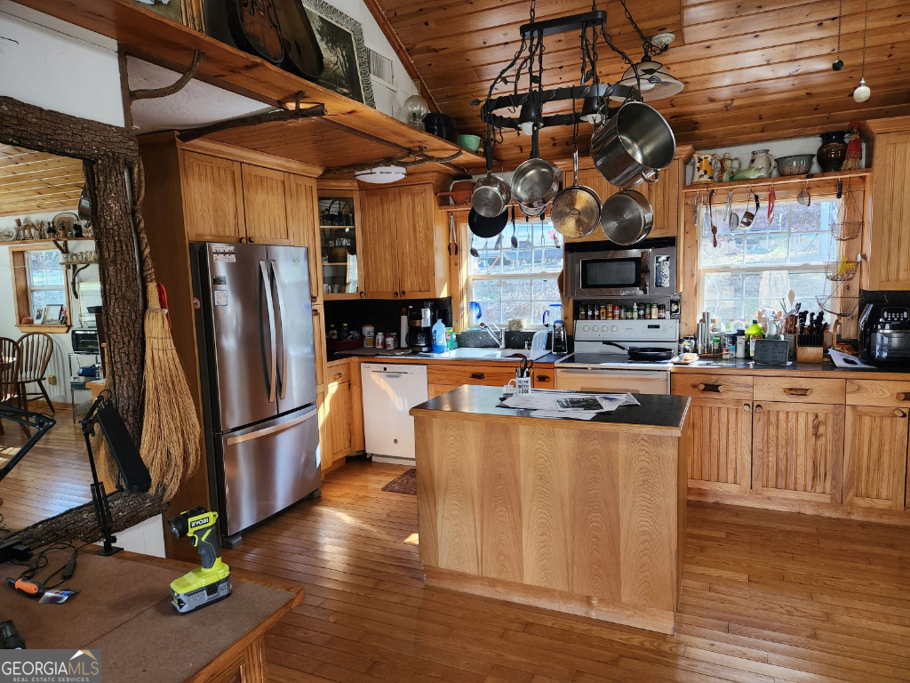 2594 Blue Ridge Gap Road Clayton, GA 30525 - Photo 5 of 77 a kitchen with stainless steel appliances granite countertop a refrigerator a sink a stove and a wooden floors