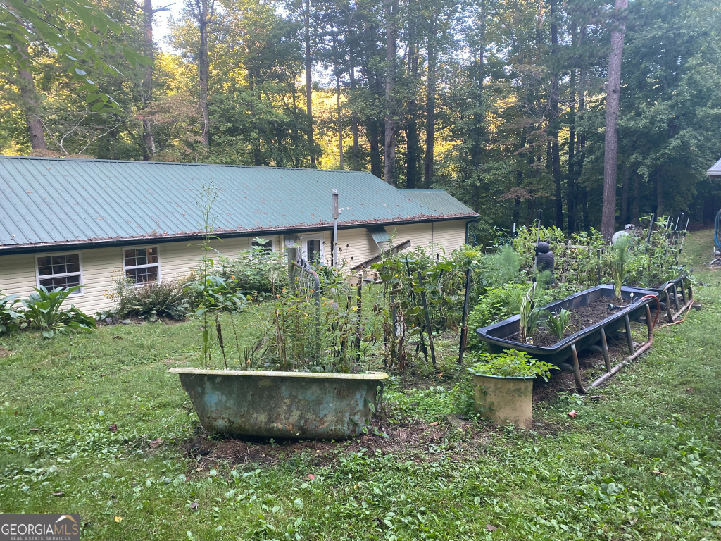 2594 Blue Ridge Gap Road Clayton, GA 30525 - Photo 72 of 77 a view of a house with backyard and sitting area