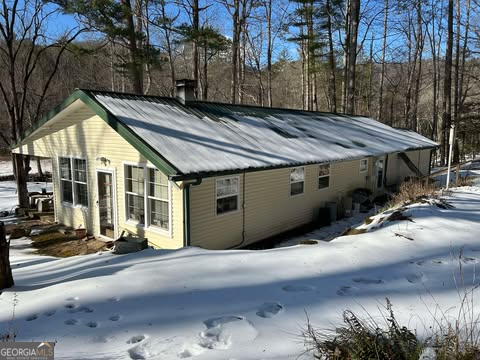2594 Blue Ridge Gap Road Clayton, GA 30525 - Photo 74 of 77 a view of a house with a yard and wooden fence