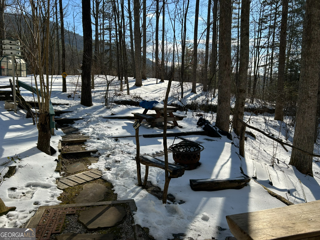 2594 Blue Ridge Gap Road Clayton, GA 30525 - Photo 9 of 77 a view of swimming pool with chairs and wooden fence