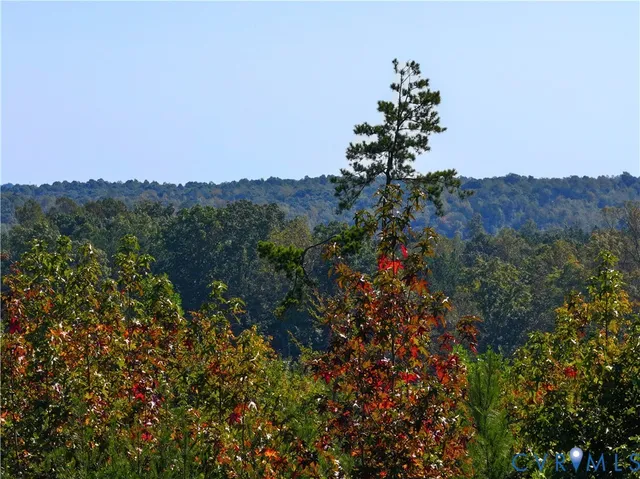 a view of a house with a mountain in the background