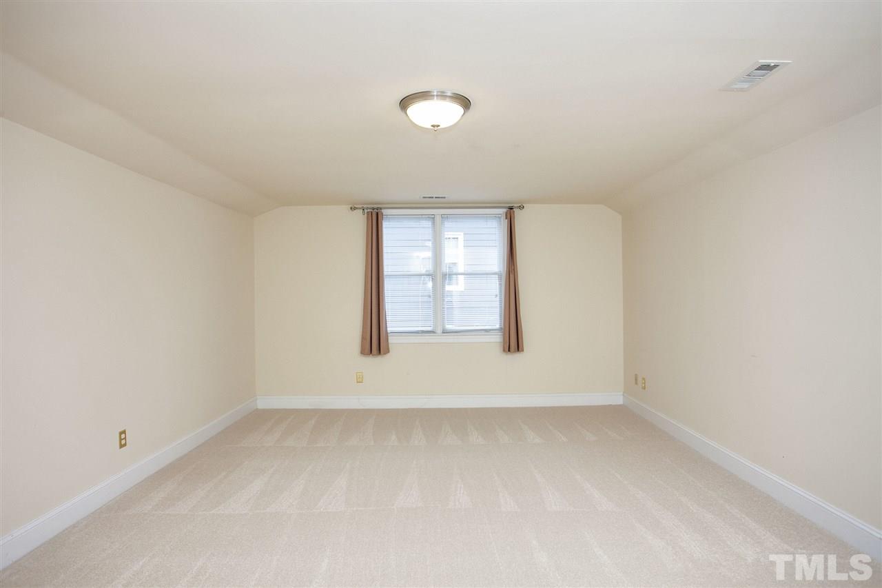 5216 Covington Bend Drive Raleigh, NC 27613 - Photo 11 of 15 The huge bonus room/bedroom offers tremendous flexibility. It can be a large bedroom which can accommodate a couple of people, or a multi purpose bonus room, ideal for a home theater, office, exercise room, or anything else you need.