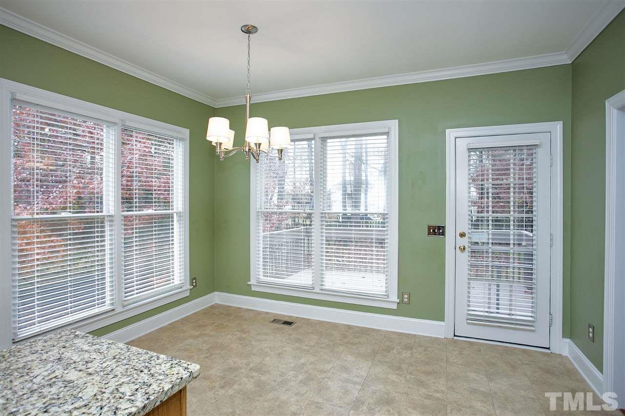 5216 Covington Bend Drive Raleigh, NC 27613 - Photo 6 of 15 The breakfast room is perfectly situated off of the kitchen, and adjacent to the door leading to the deck.