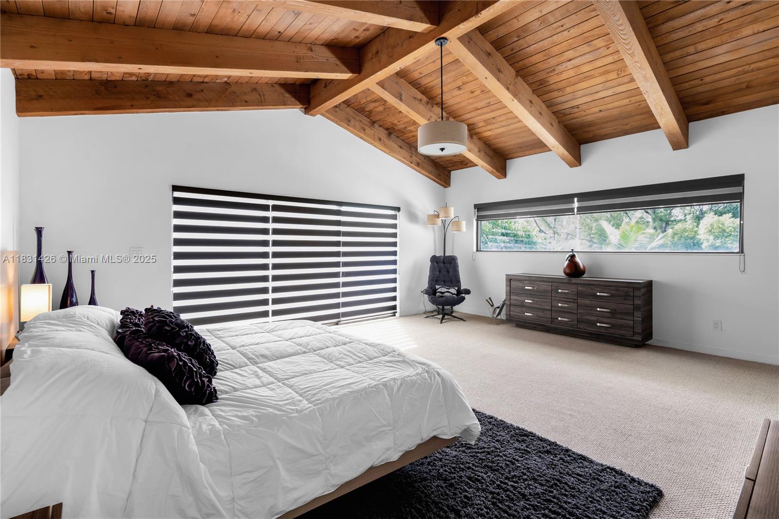 3520 Rockerman Road Miami, FL 33133 - Photo 26 of 41 a bed sitting in a bedroom next to a window