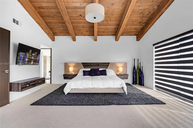 a view of living room filled with furniture and a window