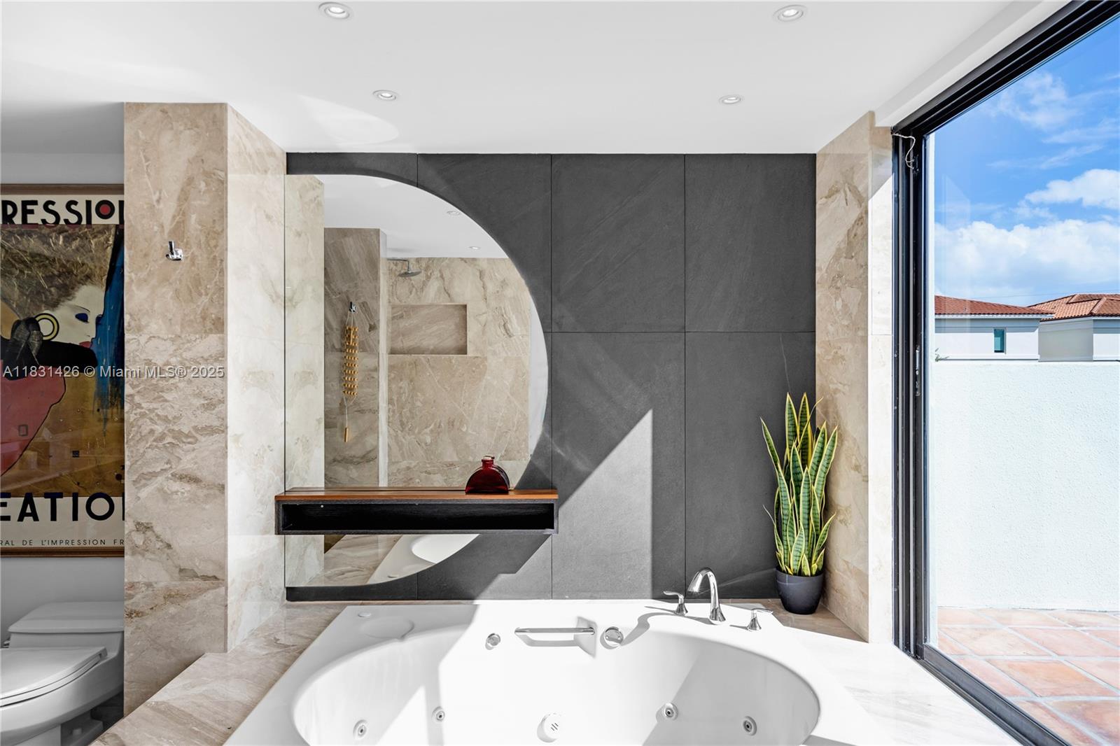 3520 Rockerman Road Miami, FL 33133 - Photo 31 of 41 a bathroom with a sink and a mirror