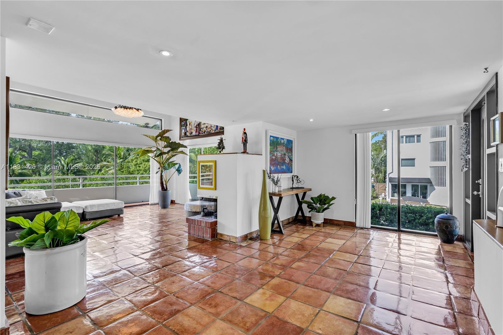 3520 Rockerman Road Miami, FL 33133 - Photo 7 of 41 a view of a patio with table and chairs potted plants with wooden floor