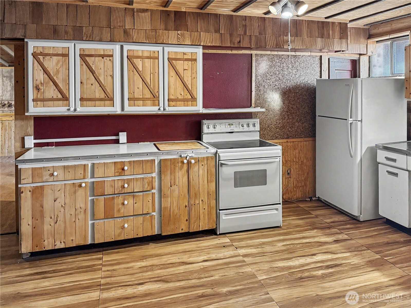 802 South Chelan Avenue Wenatchee, WA 98801 - Photo 14 of 40 a kitchen with a stove top oven cabinets and stainless steel appliances