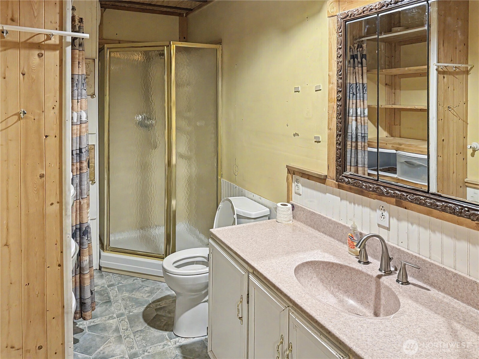 802 South Chelan Avenue Wenatchee, WA 98801 - Photo 18 of 40 a bathroom with a granite countertop sink toilet and shower