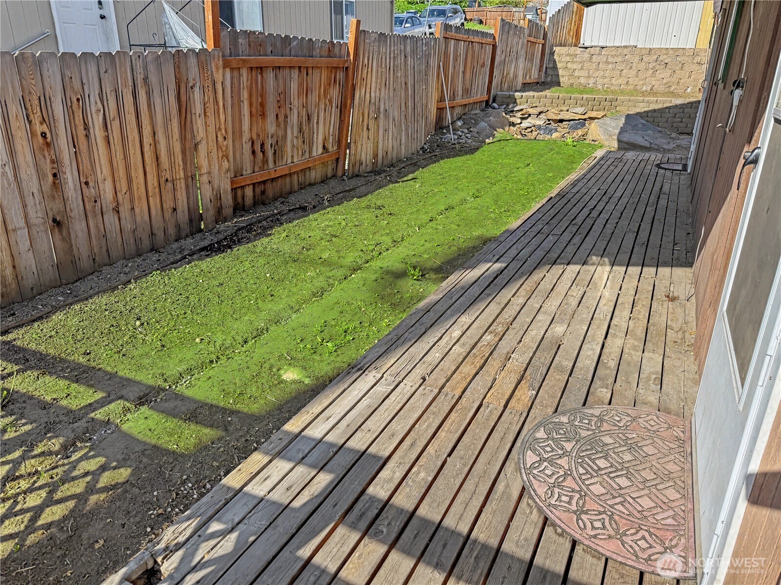 802 South Chelan Avenue Wenatchee, WA 98801 - Photo 20 of 40 a view of a backyard with wooden fence