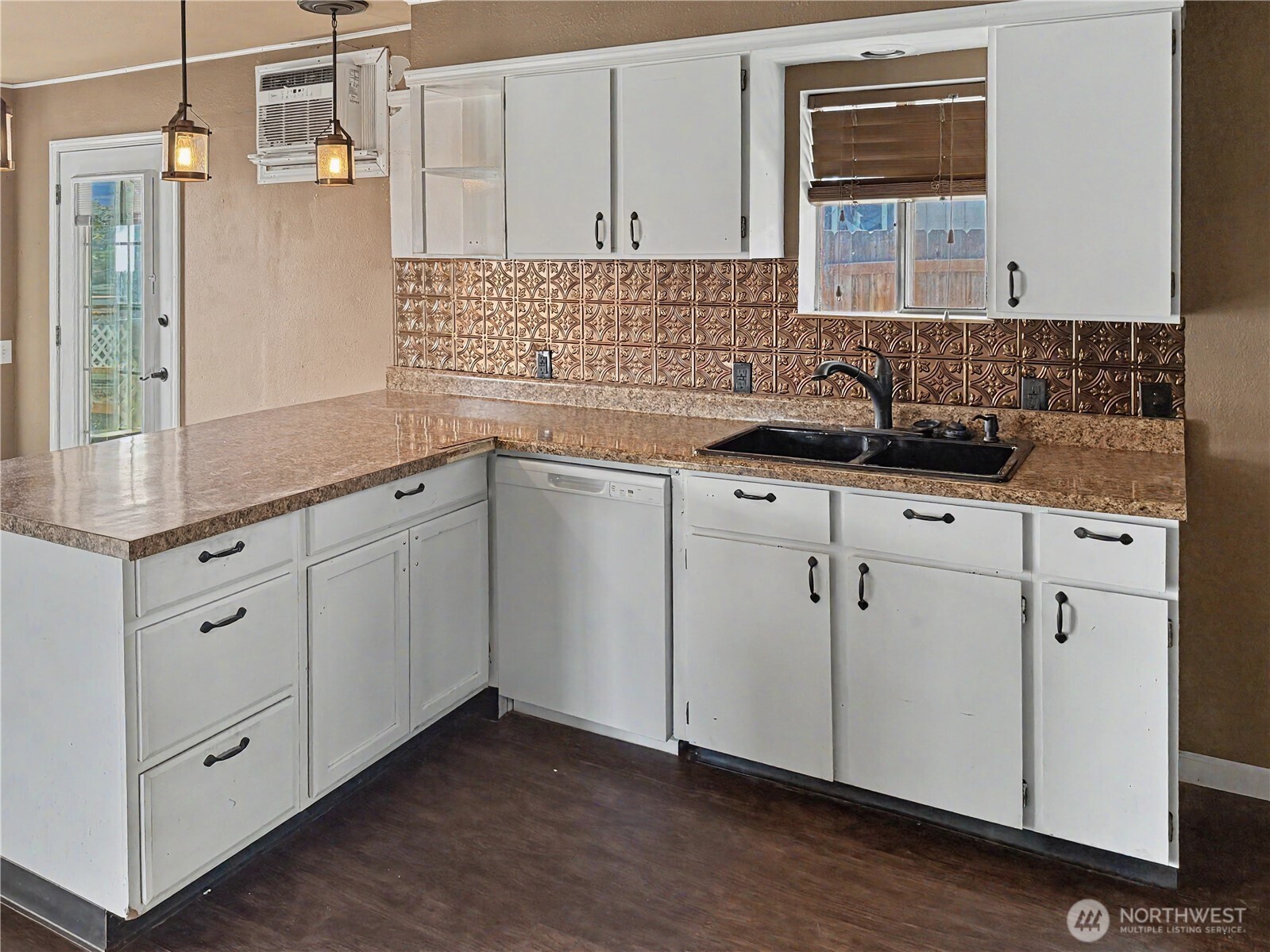 802 South Chelan Avenue Wenatchee, WA 98801 - Photo 26 of 40 a kitchen with sink cabinets and wooden floor