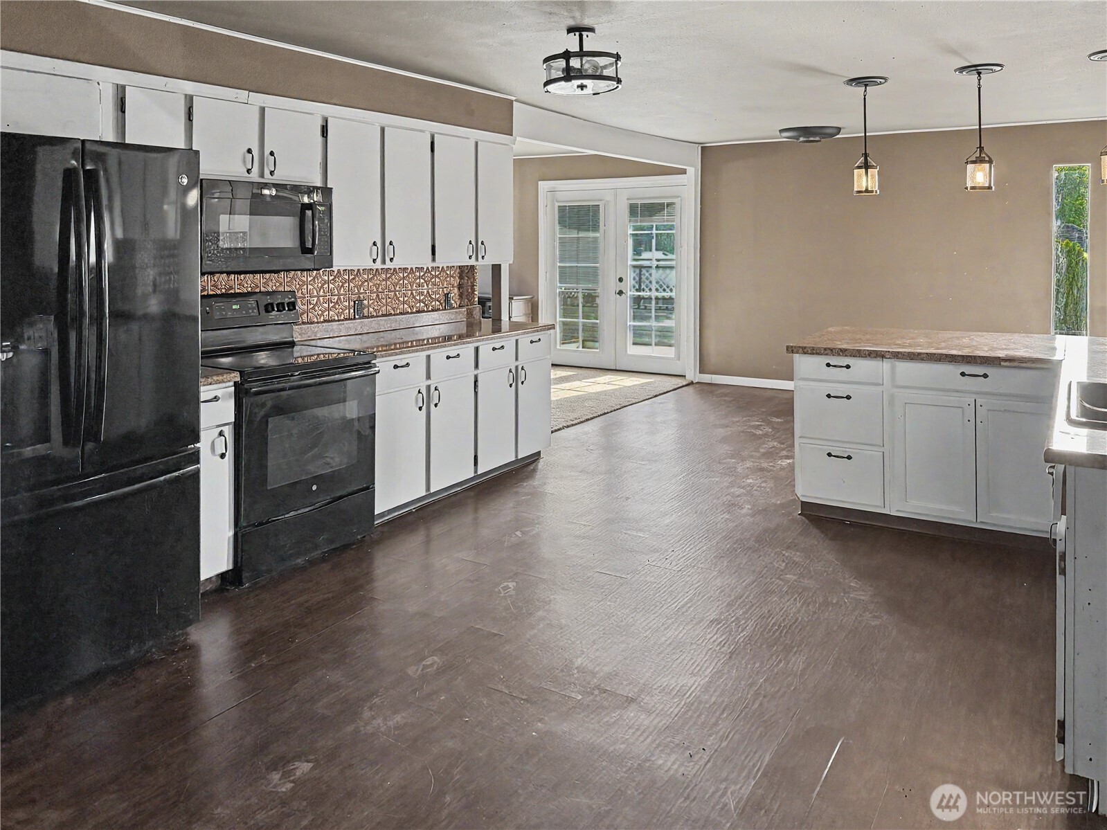 802 South Chelan Avenue Wenatchee, WA 98801 - Photo 28 of 40 a kitchen with stainless steel appliances a refrigerator sink and stove
