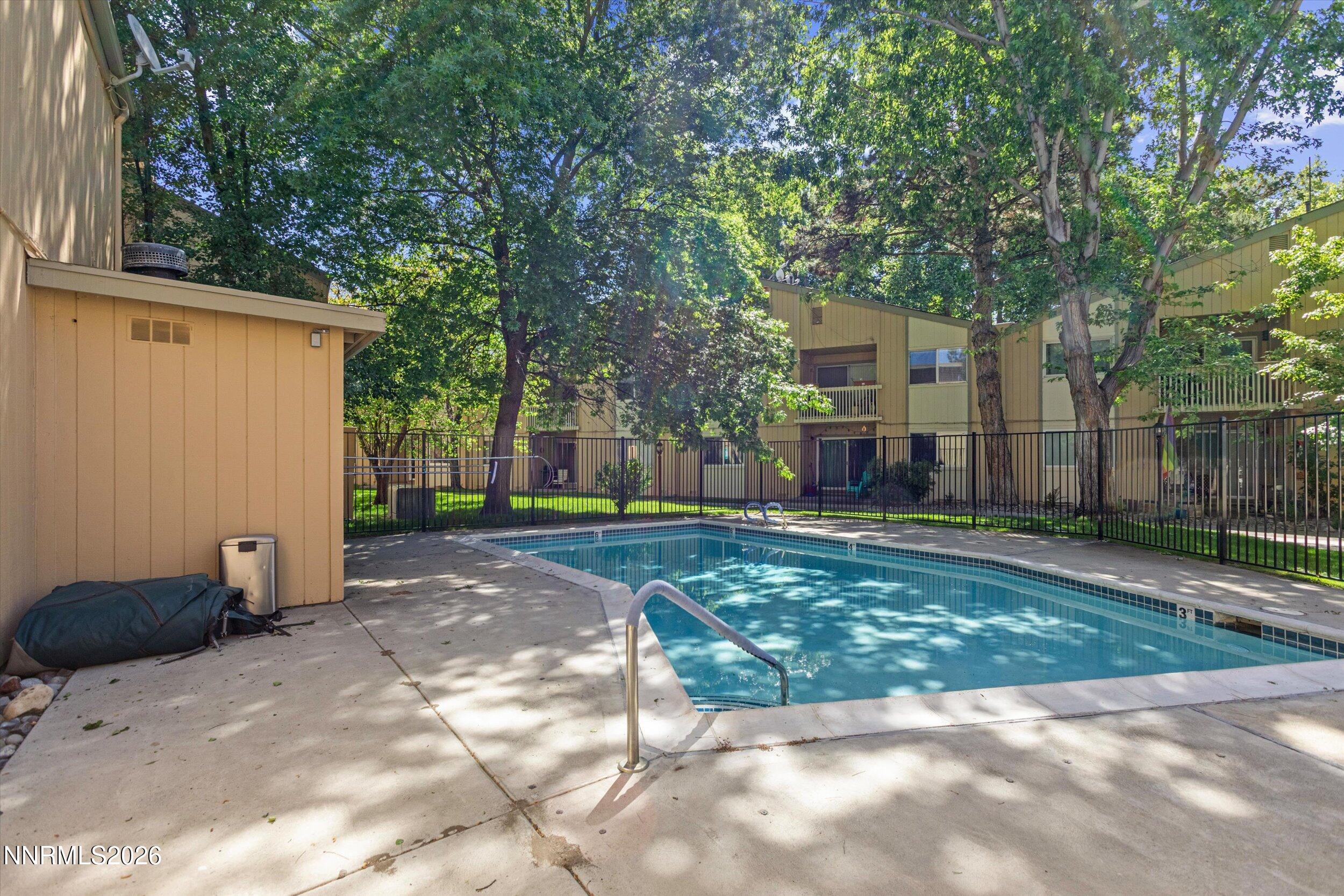 2300 Dickerson Road, Unit 51 Reno, NV 89503 - Photo 27 of 46 a view of a backyard with a large tree
