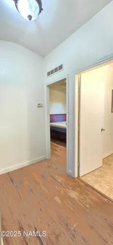 a bathroom with a granite countertop toilet and a shower