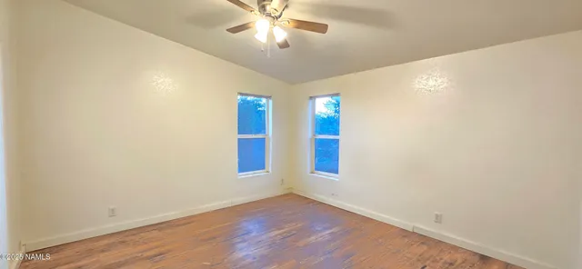 an aerial view of residential house with an outdoor space and seating
