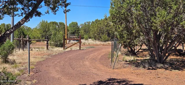 a view of a wooden bench in front of a house