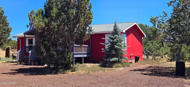 a view of backyard of a house