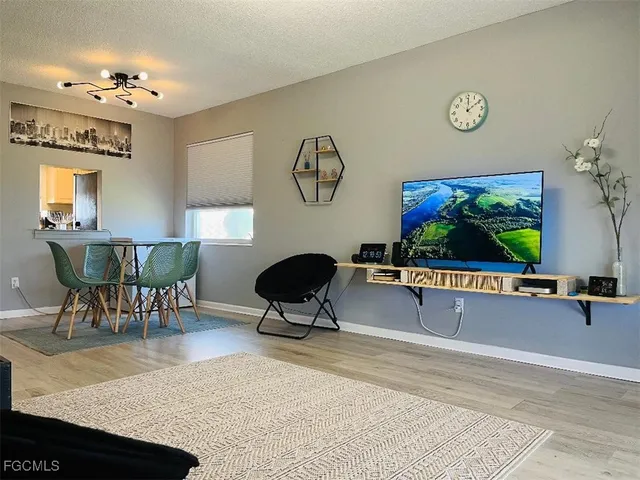 a view of a livingroom with furniture and a table