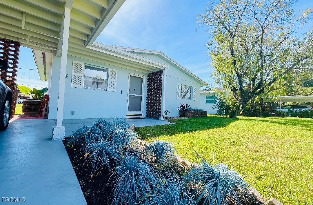 2210 Croton Court Lehigh Acres, FL 33936 - Photo 3 of 13 a view of house with backyard and swimming pool